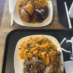 Time Out Cafe and Eatery - Plates with yellow rice, beans, chicken and beef