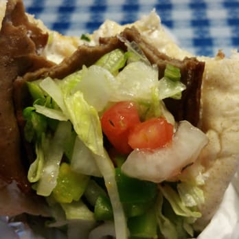 Mad Greek Grill - Carved gyro. Smelled so good I had to take a bite before snapping a pic. - Greek Near Me - High Point, North Carolina Mad Greek Grill - Carved gyro. Smelled so good I had to take a bite before snapping a pic. - Greek Near Me - High Point, North Carolina