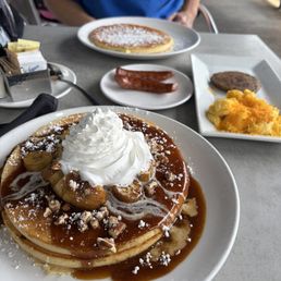 banana foster pancakes, eggs, sausage. banana foster pancakes, eggs, sausage.