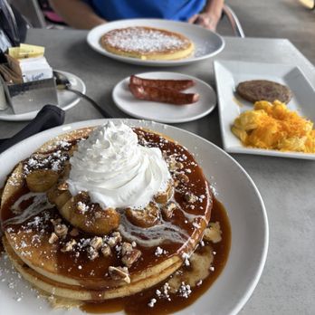 Brick & Spoon - Orange Beach - banana foster pancakes, eggs, sausage. - Breakfast & Brunch Near Me - Orange Beach, Alabama