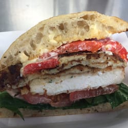Curb Your Appetite - Chicken Touille:Grilled Ciabatta with garlic mayo spinach tomato chicken cutlet breaded eggplant roasted red peppers snd provolone cheese