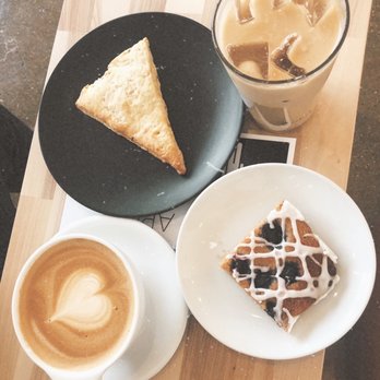 Coalescence Coffee - Oat milk latte, iced whole milk latte, blueberry coffee cake, and lemon + rosemary scone - Coffee & Tea Near Me - Norfolk, Virginia Coalescence Coffee - Oat milk latte, iced whole milk latte, blueberry coffee cake, and lemon + rosemary scone - Coffee & Tea Near Me - Norfolk, Virginia