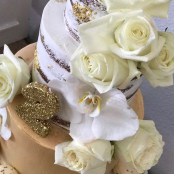 Panaderia Monarca - a wedding cake with white flowers - Bakeries Near Me - Houston, Texas Panaderia Monarca - a wedding cake with white flowers - Bakeries Near Me - Houston, Texas