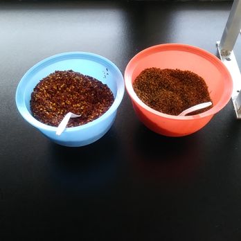 Super Taco - Spices at the salsa bar! Red pepper flakes and oregano ( i believe ) - Mexican Near Me - Bakersfield, California