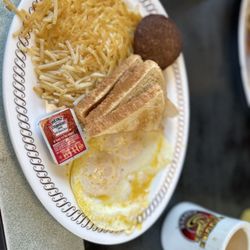 Eggs, toast, sausage and hash browns