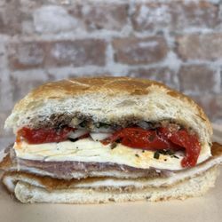 Parisi Bakery - The Dennis with roasted peppers on a roll (added onions)