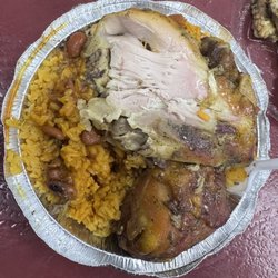 Nelly's Restaurant - Baked chicken (started eating already), beans , rice