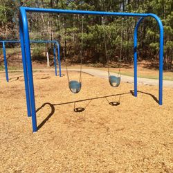 Hembree Park Recreation Center - Baby swings & big kid swings in the back.