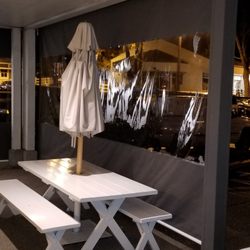 Gianola Canvas Products - Convert an outdoor space for all kinds of weather.  Roll up drop wall with clear vinal windows.
