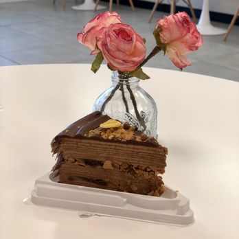 T-Swirl Crepe - a piece of chocolate cake on a plate - Creperies Near Me - Hicksville, New York T-Swirl Crepe - a piece of chocolate cake on a plate - Creperies Near Me - Hicksville, New York