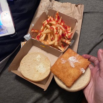 McDonald's - a person holding a sandwich and fries - Fast Food Near Me - Clermont, Florida McDonald's - a person holding a sandwich and fries - Fast Food Near Me - Clermont, Florida