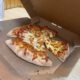 a half eaten pizza in a box
