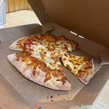 Marco's Pizza - a half eaten pizza in a box - Pizza Near Me - Tucson, Arizona