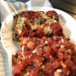 two slices of pizza on a paper plate two slices of pizza on a paper plate