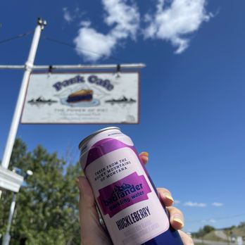 Park Cafe - The sign outside for Park Cafe and the can of sparkling huckleberry water - American Near Me - Saint Mary, Montana Park Cafe - The sign outside for Park Cafe and the can of sparkling huckleberry water - American Near Me - Saint Mary, Montana