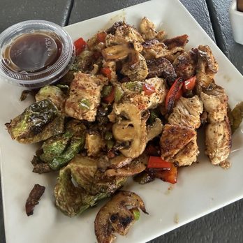 Brookhaven Pub & Grill - Grit & Grind Grilled chicken, mushrooms, onions, peppers, Brussels sprouts and Asian dressing. - Pubs Near Me - Memphis, Tennessee