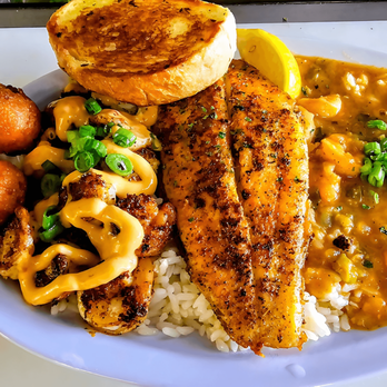 The Catch: Meyerland - A Cajun favorite featuring shrimp étouffée over rice, fried catfish, Bang Bang shrimp, garlic bread, and hush puppies. - Seafood Near Me - Houston, Texas The Catch: Meyerland - A Cajun favorite featuring shrimp étouffée over rice, fried catfish, Bang Bang shrimp, garlic bread, and hush puppies. - Seafood Near Me - Houston, Texas