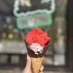 Big Dipper Ice Cream & Yogurt Parlour - Two scoops in a chocolate dipped waffle cone! Watermelon ice and peppermint stick!