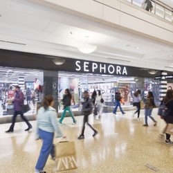 Kings Plaza Shopping Center - Shoppers walk past the Sephora storefront inside Kings Plaza.