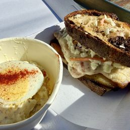 Pastrami with Swiss, cole slaw and mustard on grilled marble rye. That is a HALF sandwich. Pastrami with Swiss, cole slaw and mustard on grilled marble rye. That is a HALF sandwich.