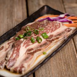 Seoul Kalbi Korean BBQ - The signature item! Seoul KALBI LA style, marinaded bone-in flank stead.