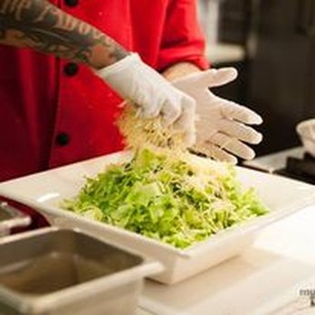 Taste Collective - a chef preparing a salad - Food Trucks Near Me Taste Collective - a chef preparing a salad - Food Trucks Near Me