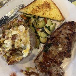Bills Steakhouse - April NY steak special with loaded baked potato.