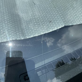 Safelite AutoGlass - Hard to see but the long cracks from safelite. The small dash in the middle was the original crack. Look up toward the window shade - Auto Glass Services Near Me - Charlotte, North Carolina Safelite AutoGlass - Hard to see but the long cracks from safelite. The small dash in the middle was the original crack. Look up toward the window shade - Auto Glass Services Near Me - Charlotte, North Carolina