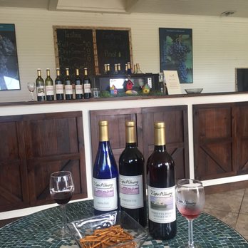 The Cape Winery - Enjoying our glasses of wine and our bottles we bought to restock our wine supply! - Wine Tours Near Me - Cape Vincent, New York The Cape Winery - Enjoying our glasses of wine and our bottles we bought to restock our wine supply! - Wine Tours Near Me - Cape Vincent, New York