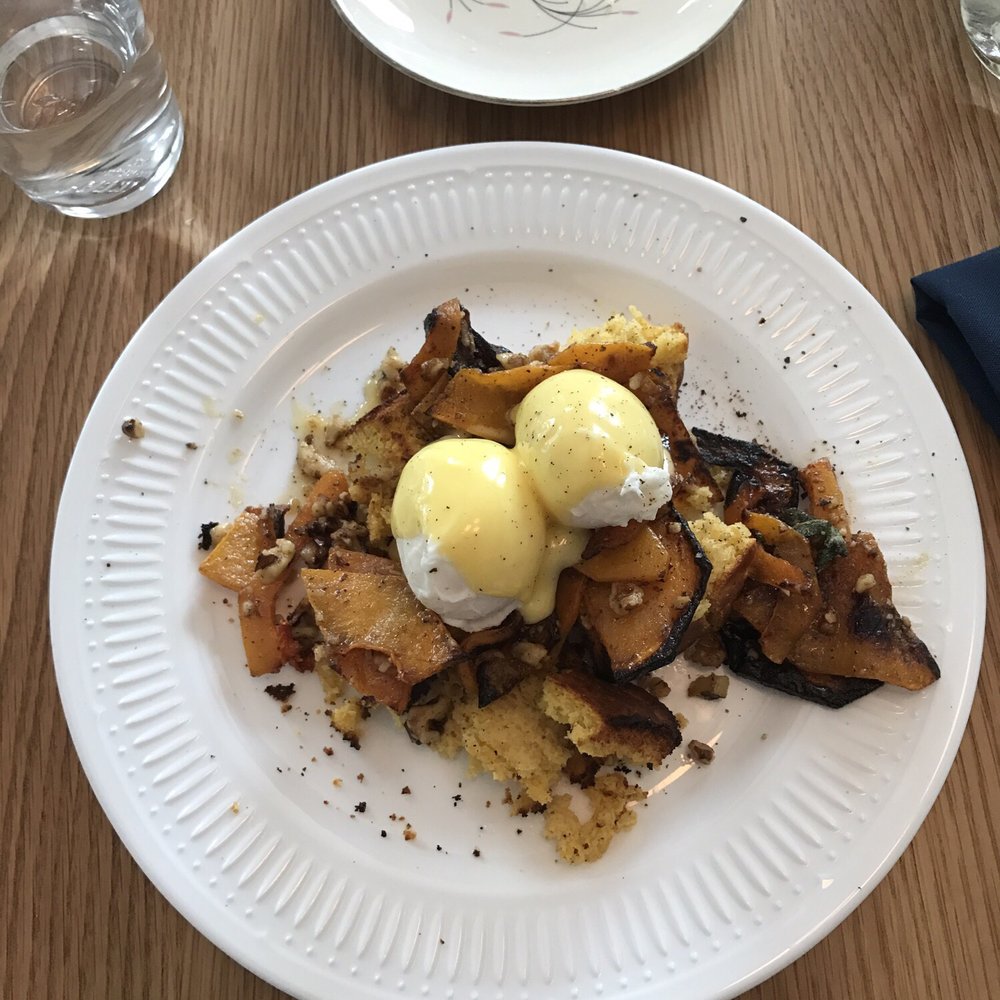 afternoon - poached eggs over some roasted butternut squash, cornbread, walnuts, sage, and brown butter hollandaise sauce - New American Near Me - Gainesville, Florida