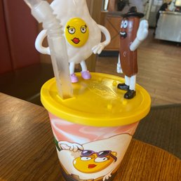 a cup of ice cream with an egg on top