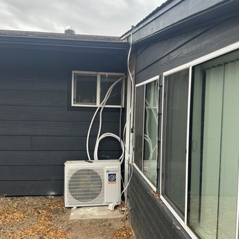 Arizona Home Improvement Solutions - Split unit placed on ground and not weathered down. Went through all. See other pic to where it went inside. - General Contractors Near Me
