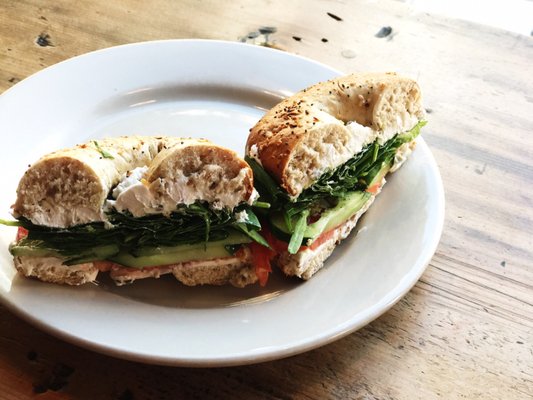 Photo of Grindcore House - Philadelphia, PA, US. Toasted everything with jalapeƱo cream cheese, spinach, tom and cucumber. One of my favs