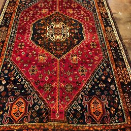 A Camel wool Persian rug that was on display.