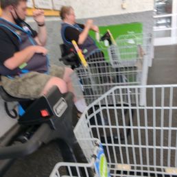 Two employees using carts for their breaks