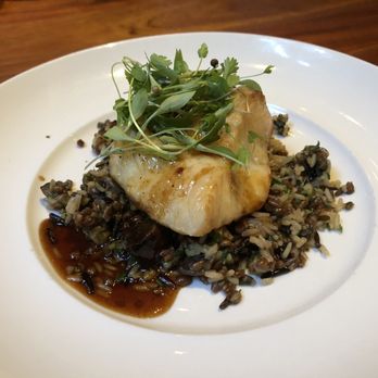 Seasons 52 - Chilean sea bass with ginger demi-glaze over wild rice and mushrooms - New American Near Me - Orlando, Florida