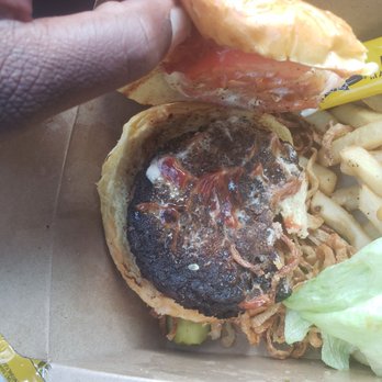 Bourbon Street - I asked 4 well done but this seemed burnt, I took a photo 4 u to decide what are your thoughts? I also asked 4 cheese, onions heavy mAyo - Cajun/Creole Near Me - Bayside, New York