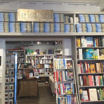 Page & Palette - Entrance to the Book Cellar. Those are all copies of Forrest Gump above it. - Bookstores Near Me - Fairhope, Alabama Page & Palette - Entrance to the Book Cellar. Those are all copies of Forrest Gump above it. - Bookstores Near Me - Fairhope, Alabama