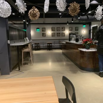 Commonplace Coffee - a woman standing in a coffee shop - Coffee & Tea Near Me - Pittsburgh, Pennsylvania