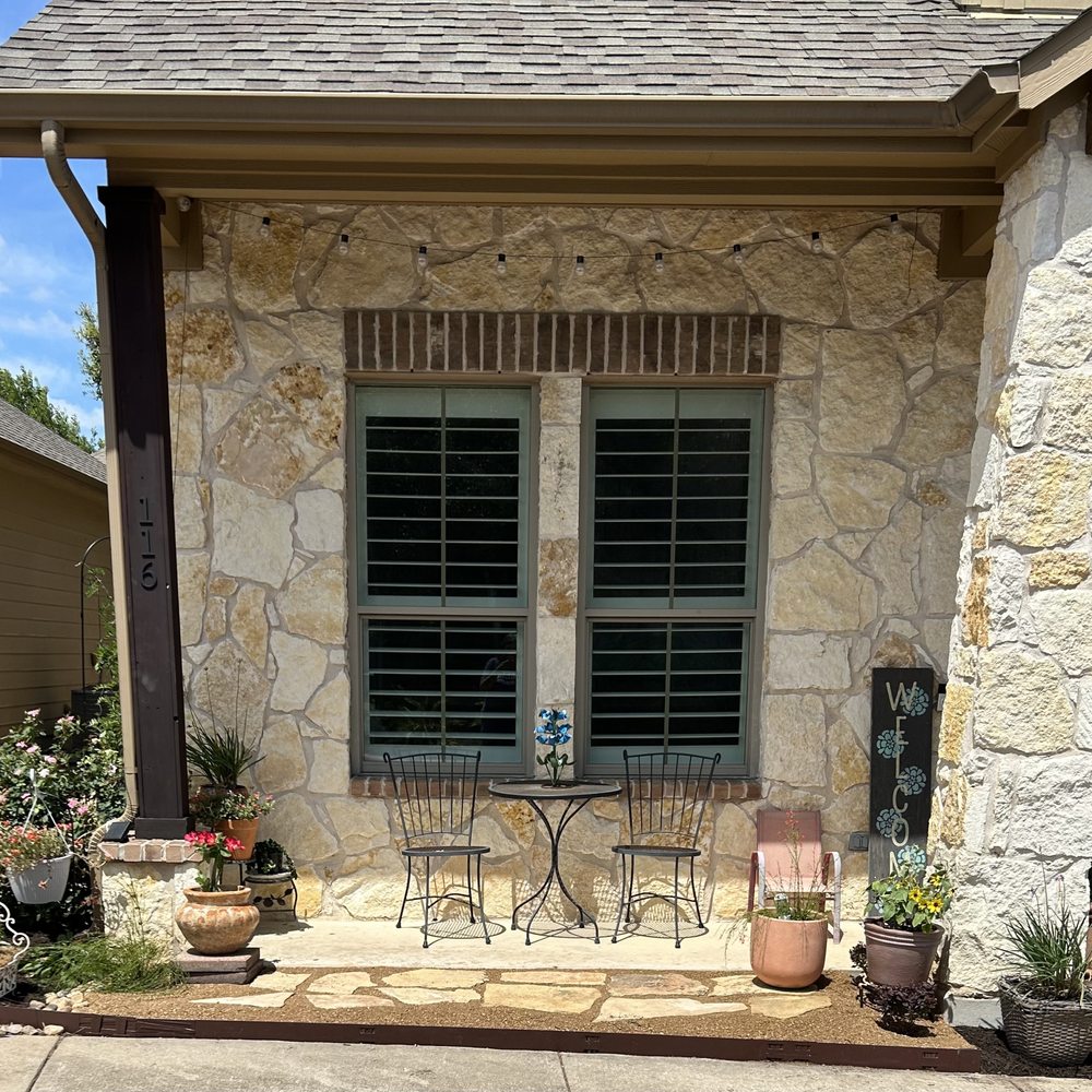 North Pearl Landscaping - a patio with chairs and a table - Landscaping Near Me