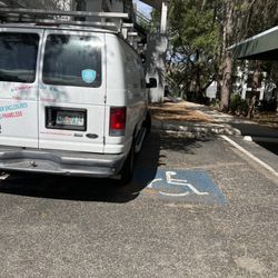 A Christian Glass & Mirror - Taking up not one but TWO handicapped spots.