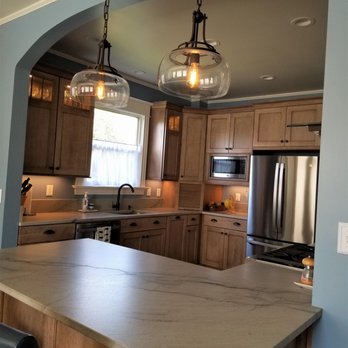 Essense Interior Design - Kitchen remodel with farmhouse pendant lighting and natural quartzite countertops - Interior Design Near Me - Seattle, Washington Essense Interior Design - Kitchen remodel with farmhouse pendant lighting and natural quartzite countertops - Interior Design Near Me - Seattle, Washington