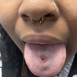 Goodfellas Tattoos - Hole from piercing ball