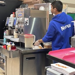a man preparing food in a restaurant a man preparing food in a restaurant