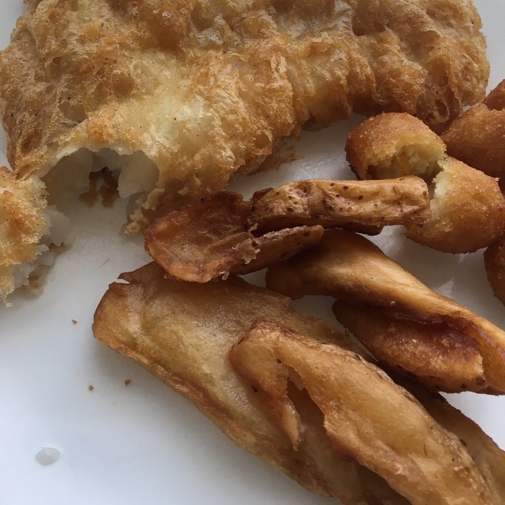 Fried cod and hush puppies. The potato slices were not from them.