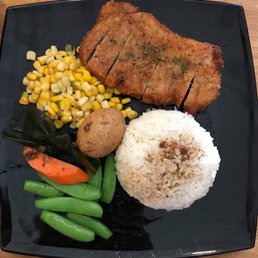 a plate of meat, rice, and vegetables