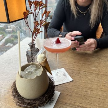 Oblix At The Shard - White chocolate Pina Colada on the left, kiss the rainbow martini - Lounges Near Me - London, XGL Oblix At The Shard - White chocolate Pina Colada on the left, kiss the rainbow martini - Lounges Near Me - London, XGL