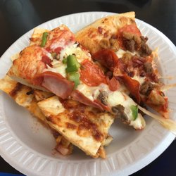 Tiffany's Pizza - A slice of supreme, a slice of meat lovers, and a mess of bbq chicken pizza.