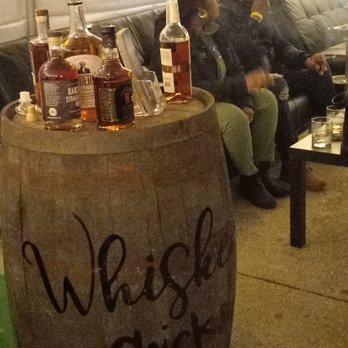 Whiskey Chicks - Owner setting up seating and decor for recent Cigar lounge. - Bartenders Near Me Whiskey Chicks - Owner setting up seating and decor for recent Cigar lounge. - Bartenders Near Me