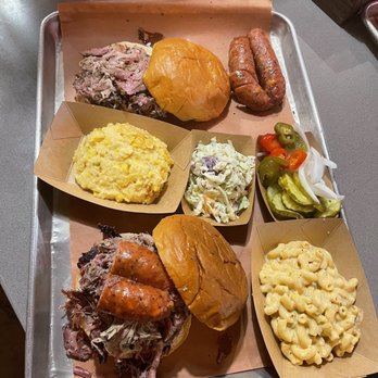 Caldwell County BBQ - El General Patton Sandwich, East Side Pig, Aunt Susan's Corn Casserole, Julio's Mac 'N Cheese, and and extra Sausage Link. - Barbeque Near Me - Gilbert, Arizona Caldwell County BBQ - El General Patton Sandwich, East Side Pig, Aunt Susan's Corn Casserole, Julio's Mac 'N Cheese, and and extra Sausage Link. - Barbeque Near Me - Gilbert, Arizona